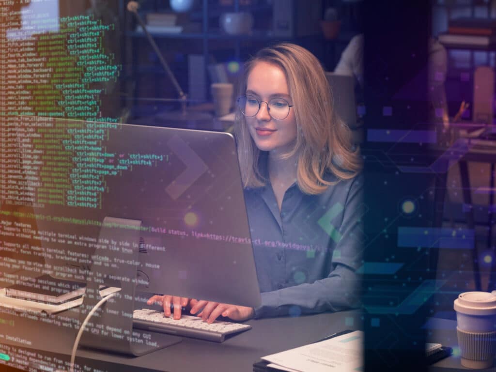 Woman working on a laptop, writing code | BetterSoftware